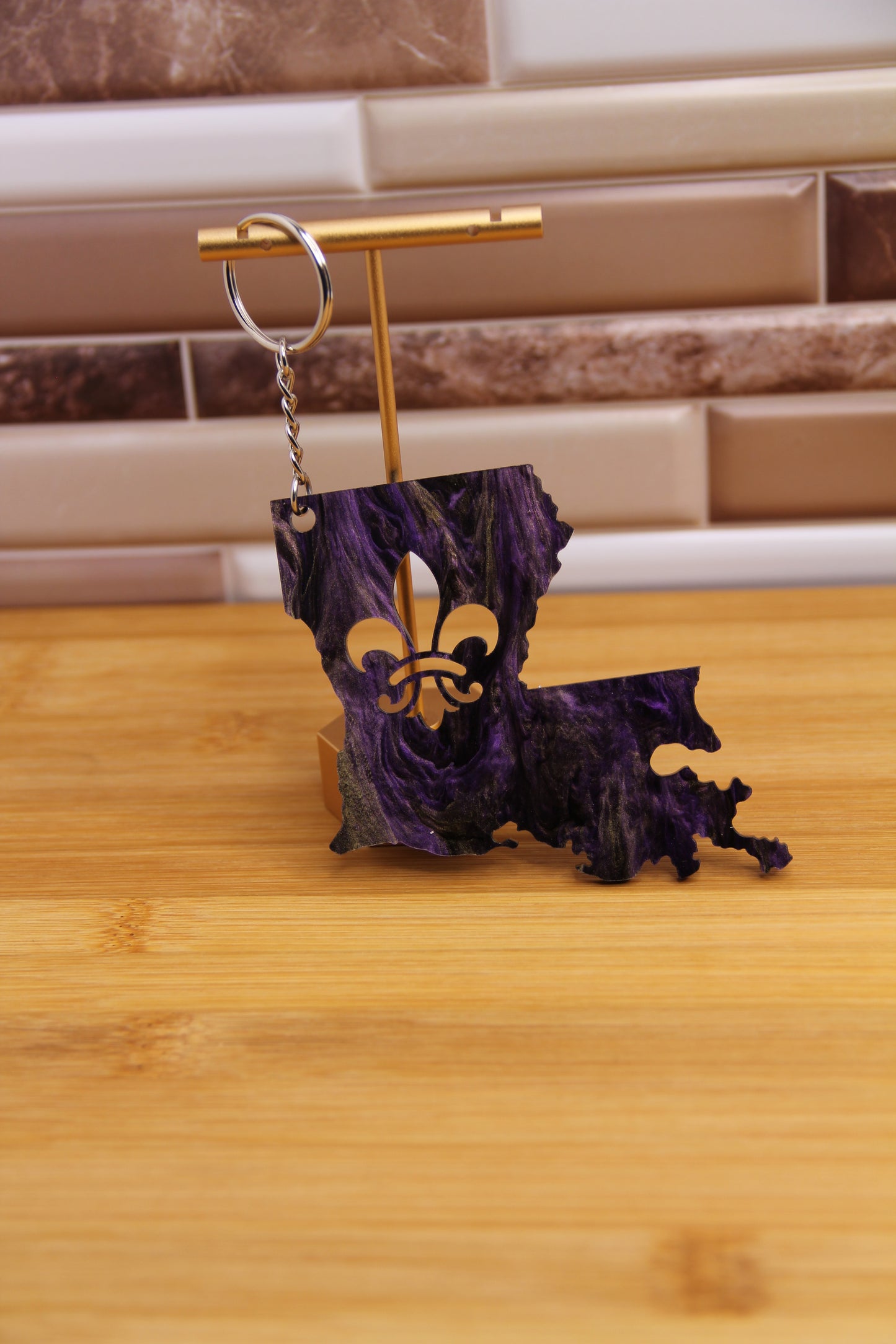 Louisiana shaped keychain with fleur-de-lis